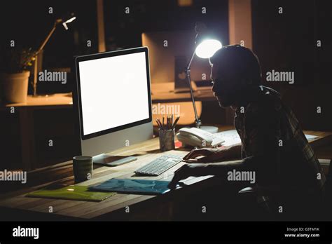 Using computer business night hi-res stock photography and images - Alamy