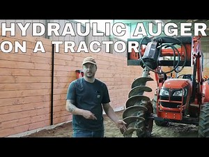 #67 HYDRAULIC AUGER ON A TRACTOR.