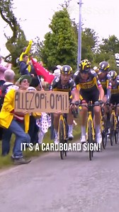 9.6K views · 129 reactions |  ON THIS DAY in 2021... Le Tour de France came to a grinding halt after a spectator stood too close to the peloton while holding a sign that read, "Allez Opi, Omi".  This crash is one the #couchpeloton will NEVER forget!  | SBS Sport | Facebook