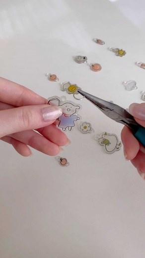 ever so softly on Instagram: "how to make shrinky dink keychains! i’m definitely not an expert but i thought i’d share my process behind making the keychains available on my shop! the keychains i made last time sold out so fast - i’m hoping the new designs do not disappoint 🤧💪🏻 shop update is coming to you at 2pm EST - january 22nd (hopefully), so mark your calendars !!!"