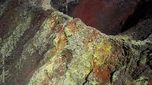 Geldingadalir volcano craters in Reykjanes Iceland after the eruptions had stopped, resulting in colourful lava, mineral and sulphur deposits around the craters and lava fields Stock Video