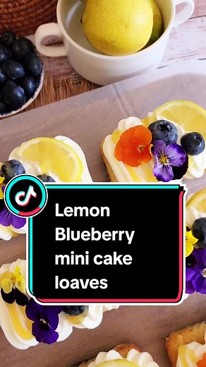 LEMON BLUEBERRY MINI CAKE LOAVES Blueberry season is almost over, but I wanted to make these mini lemon blueberry loaves for dessert tonight. The loaves are topped with sweetened whipped cream, fresh fruit, lemon curd, and edible flowers. You will need: 3 eggs - room temperature 1 cup sugar 1 tsp vanilla essence 1/2 cup butter/baking margarine - melted and cooled 1 cup milk 2 cups flour 4 tsp baking powder Zest of 1 lemon Juice of 1 lemon 250g blueberries Sweetened whipped cream 300ml cream 1 tb