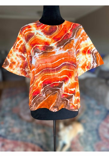 The Wave tutorial. Tied in a wave-like pattern and dyed using hot water irrigation. Shaped by time, movement, and nature’s rhythm, this piece was created with the flowing lines and organic curves of The Wave in mind. Every detail reflects the natural motion, layers, and balance found in one of the most breathtaking landscapes in the Southwest. This is a one-of-a-kind piece — just like the formation that inspired it. No two angles are the same, and that’s exactly what makes it special. Size large