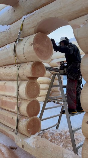 Cutting an Archway in a Douglas Fir Log Wall on a home we built a couple years ago. When this home was completed at our log yard it was loaded log by log onto a transport trailer and delivered to the home owners building site and reassembled. #loghome #arch #logwall #blockhaus #timbercabin #logcabinhomes #chainsawartist #wood #buildingyourdreamfromnature | Lake Country Log Homes - LCLH