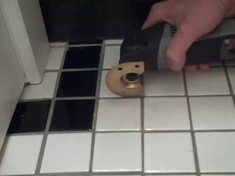 Removing a Broken Floor Tile with Dremel and ToolSnob.com