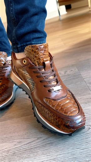 “Hello! Elevate your style with our men’s sports shoes crafted from unique python leather. Discover the perfect blend of elegance and comfort now! 🌟👟 #PythonSportsShoes #ExploreYourStyle” | VINCI Leather
