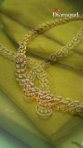 6.9K views · 1.7K reactions | Sculpted in gold. Set in brilliance This diamond necklace from GRT Jewellers reimagines tradition with a bold, sweeping design. Each segment flows seamlessly into the next, creating a graceful curve that ends in a dramatic twin-drop finish. [GRT Jewellers, Diamond Necklace, Statement Jewellery, Timeless Craftsmanship, Bold Yet Elegant, Festive Wear, Luxury Neckwear, Fine Jewellery Design] | GRT Jewellers | Facebook