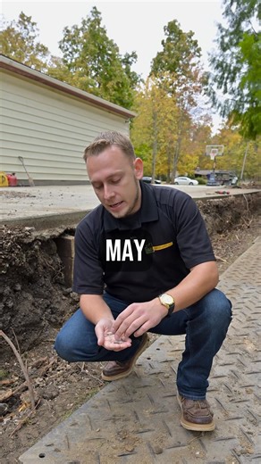 A retaining wall is only as strong as what’s beneath and behind it. Before a single block is stacked, we install a minimum of six inches of compactable, angular crushed stone — like 57 limestone — to create a stable base that prevents the wall from sinking or shifting over time. For walls under three feet, this engineered base paired with proper drainage is usually all that’s needed. For larger or load-bearing walls, an engineer may be required to design reinforcement. The real failure point for