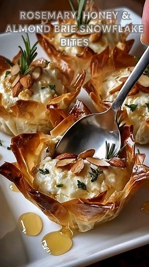 Brie cubes nestled in phyllo cups. Sprinkle rosemary and almonds, bake at 375°F for 10 minutes. Finish with a warm honey-lemon drizzle gooey, nutty, and delicately sweet. Ingredients ➤ For the Brie Bites: • 6 oz (170 g) Brie cheese, cut into small cubes • 6–8 mini phyllo cups or puff pastry shells • 2 tbsp sliced almonds, toasted • 1 egg, beaten (for egg wash) • 1 tsp finely chopped fresh rosemary FULLL Recipe in First Cօʍʍеոτ 👇👇 | Nessy Recipes