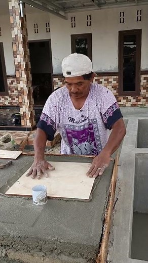 Install the first ceramic tile carefully following the cement mixture that is stuck #construction