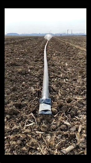 Real Engineerings | Engineering & Technology & Gadgets & DIY on Instagram: "Efficient Agriculture: The Power of Rain Hose Irrigation! 🌾💧 ​Witness the seamless activation of a modern Rain Hose Irrigation System! This simple yet brilliant engineering solution mimics natural rainfall to water crops evenly and efficiently. ​The Mechanics of "Laser Spray" Technology This video perfectly captures the fluid dynamics involved in pressurizing a flexible piping system: ​The Deployment: The system uses a